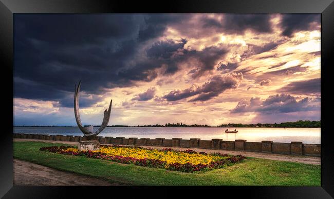 The sculpture Wings on the Palic lake under the cloudy sky Framed Print by Dejan Travica