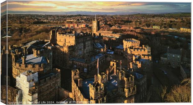 Aerial view of a historic castle at sunset with surrounding landscape and town under a golden sky in Lancaster. Canvas Print by Man And Life