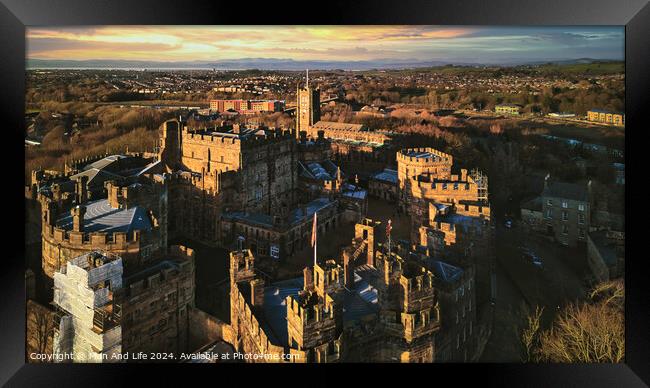 Aerial view of a historic castle at sunset with surrounding landscape and town under a golden sky in Lancaster. Framed Print by Man And Life
