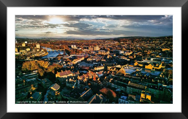 Aerial view of a city Lancaster at sunset with warm lighting, highlighting the urban landscape and river. Framed Mounted Print by Man And Life