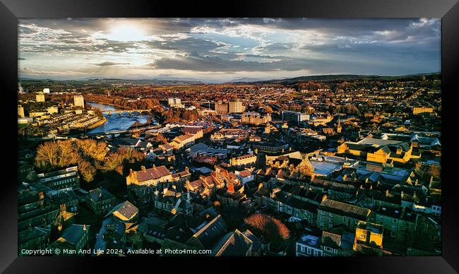 Aerial view of a city Lancaster at sunset with warm lighting, highlighting the urban landscape and river. Framed Print by Man And Life