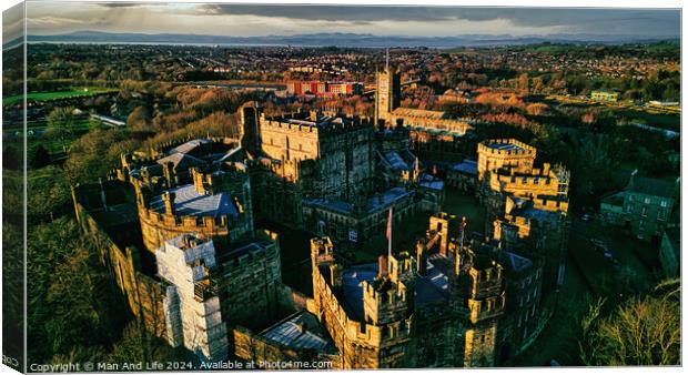 Aerial view of an ancient castle in Lancaster at sunset with lush greenery and a town in the background. Canvas Print by Man And Life