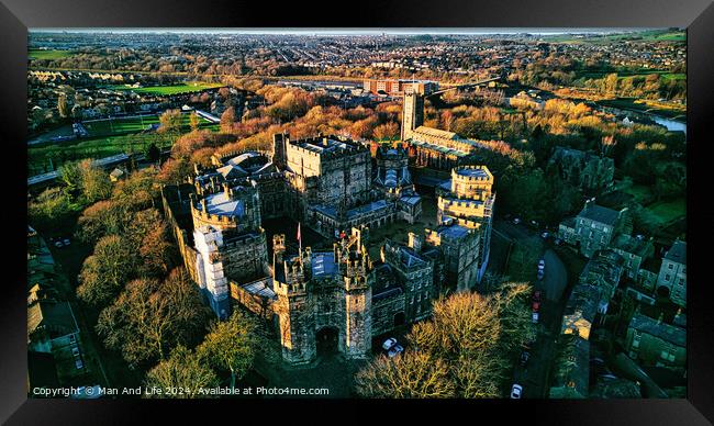 Aerial view of the Lancaster Castle amidst lush trees during sunset, with a panoramic backdrop of a quaint town. Framed Print by Man And Life
