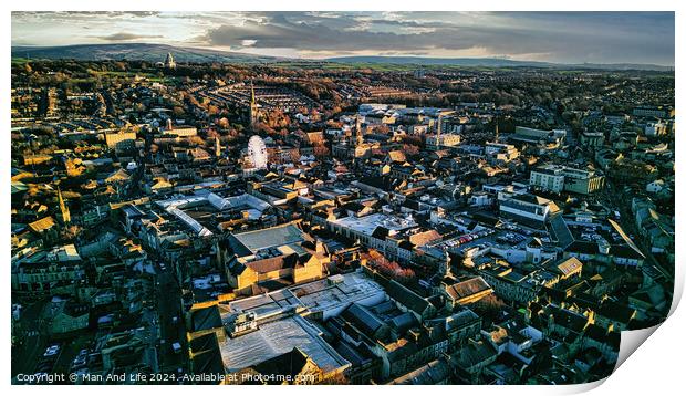 Aerial view of a city Lancaster at sunset with warm lighting highlighting the buildings and streets, showcasing the urban landscape. Print by Man And Life