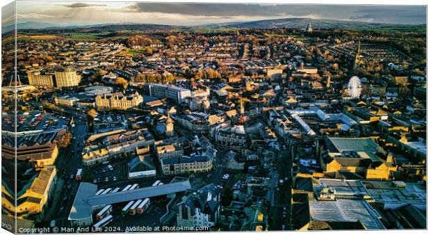 Aerial view of a city Lancaster at sunset with warm lighting highlighting the buildings and streets, showcasing the urban landscape. Canvas Print by Man And Life