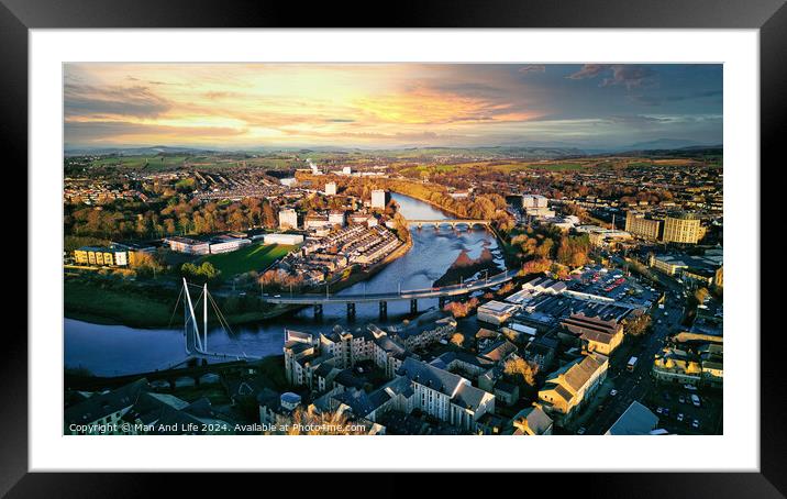 Aerial view of a city Lancaster at sunset with a river, bridges, and warm lighting. Framed Mounted Print by Man And Life