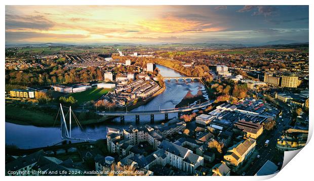Aerial view of a city Lancaster at sunset with a river, bridges, and warm lighting. Print by Man And Life