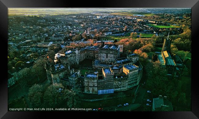 Aerial view of a historic Lancaster castle at sunset with surrounding cityscape and greenery. Framed Print by Man And Life