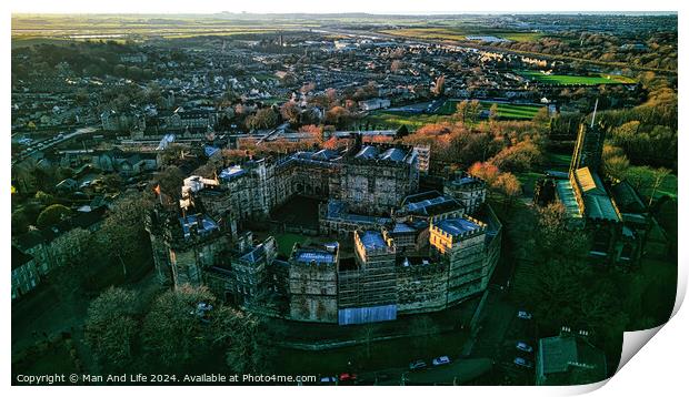 Aerial view of a historic Lancaster castle at sunset with surrounding cityscape and greenery. Print by Man And Life
