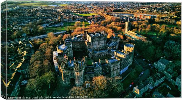 Aerial view of a majestic Lancaster castle surrounded by greenery with a town in the background during sunset. Canvas Print by Man And Life