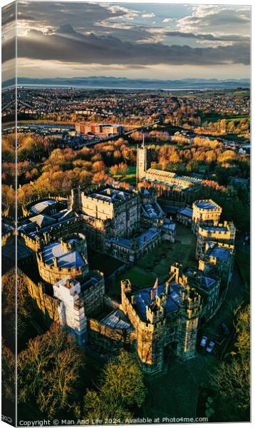 Aerial view of a historic Lancaster castle at sunset with surrounding gardens and distant cityscape. Canvas Print by Man And Life
