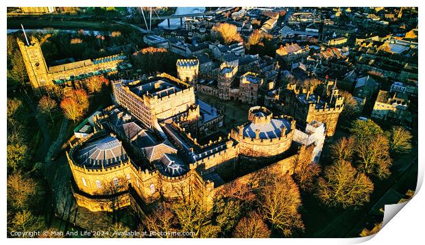 Aerial view of a majestic medieval Lancaster castle at sunset, with surrounding greenery and town in the background. Print by Man And Life
