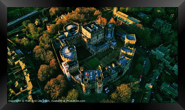 Aerial view of a majestic Lancaster castle surrounded by lush trees during golden hour, showcasing the historic architecture and scenic landscape. Framed Print by Man And Life