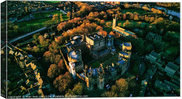 Aerial view of a historic Lancaster castle at sunset with surrounding greenery and roads. Canvas Print by Man And Life