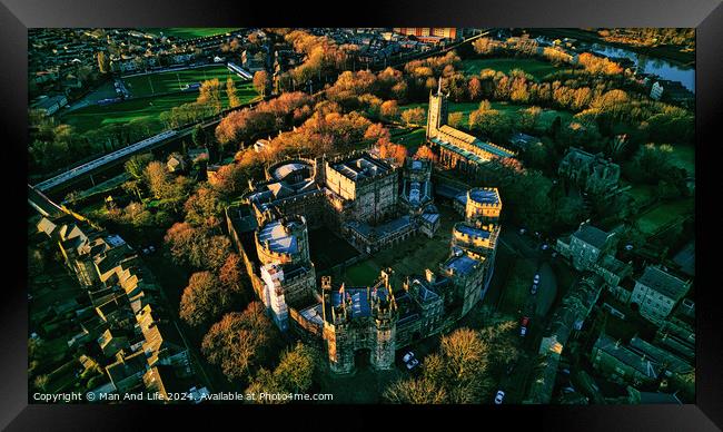 Aerial view of a historic Lancaster castle at sunset with surrounding greenery and roads. Framed Print by Man And Life