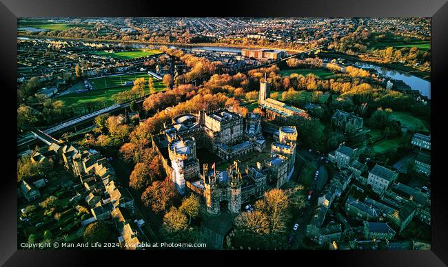 Aerial view of a historic Lancaster castle amidst a lush green landscape with surrounding urban area during golden hour. Framed Print by Man And Life