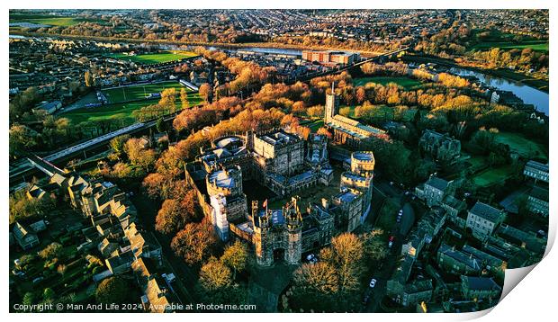Aerial view of a historic Lancaster castle amidst a lush green landscape with surrounding urban area during golden hour. Print by Man And Life