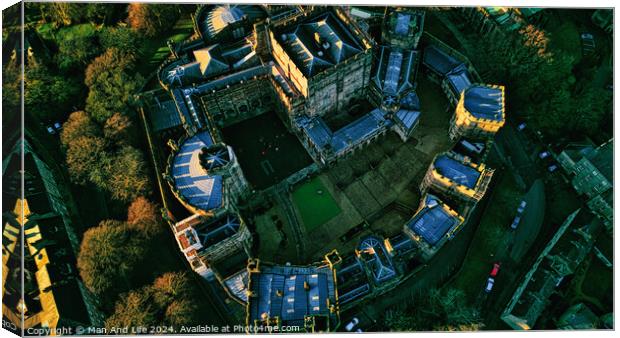 Aerial view of a historic Lancaster castle at sunset with surrounding greenery. Canvas Print by Man And Life
