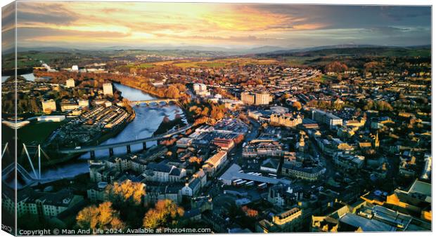 Aerial view of a city Lancaster at sunset with warm lighting, showcasing the urban landscape, buildings, and a river flowing through the center. Canvas Print by Man And Life