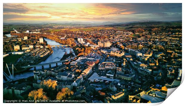 Aerial view of a city Lancaster at sunset with warm lighting, showcasing the urban landscape, buildings, and a river flowing through the center. Print by Man And Life