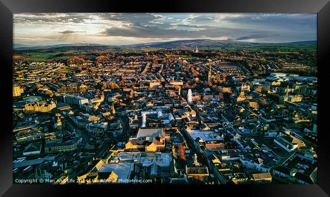 Aerial view of a city Lancaster at sunset with warm lighting, showcasing urban architecture and streets. Framed Print by Man And Life