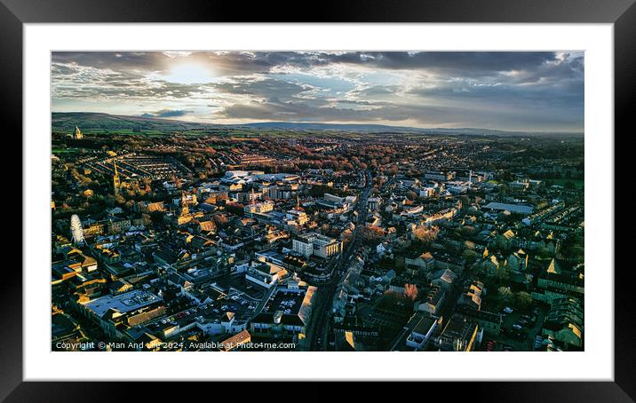 Aerial view of the Lancaster city at sunset with warm light casting over buildings and streets, showcasing urban landscape and architecture. Framed Mounted Print by Man And Life