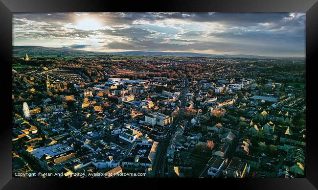 Aerial view of the Lancaster city at sunset with warm light casting over buildings and streets, showcasing urban landscape and architecture. Framed Print by Man And Life