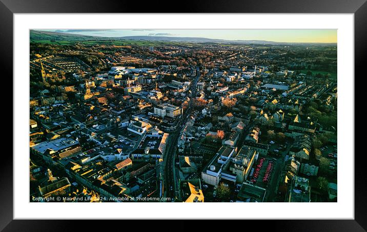 Aerial view of a cityscape at sunset with warm lighting, showcasing dense buildings and streets leading to the horizon in Lancaster. Framed Mounted Print by Man And Life