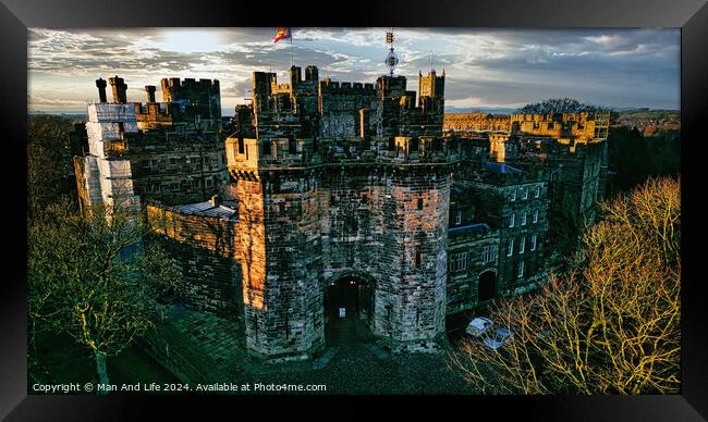 Historic medieval Lancaster castle at sunset with vibrant sky and lush greenery. Framed Print by Man And Life
