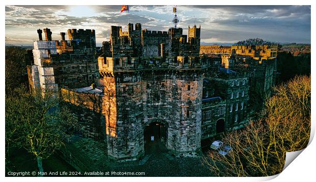 Historic medieval Lancaster castle at sunset with vibrant sky and lush greenery. Print by Man And Life