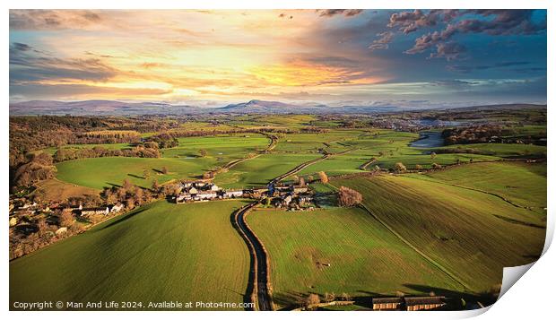 Aerial view of a picturesque village amidst green fields during sunset with a vibrant sky and a meandering river. Print by Man And Life