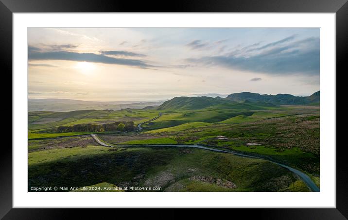 A large green field with Quiraing in the background Framed Mounted Print by Man And Life