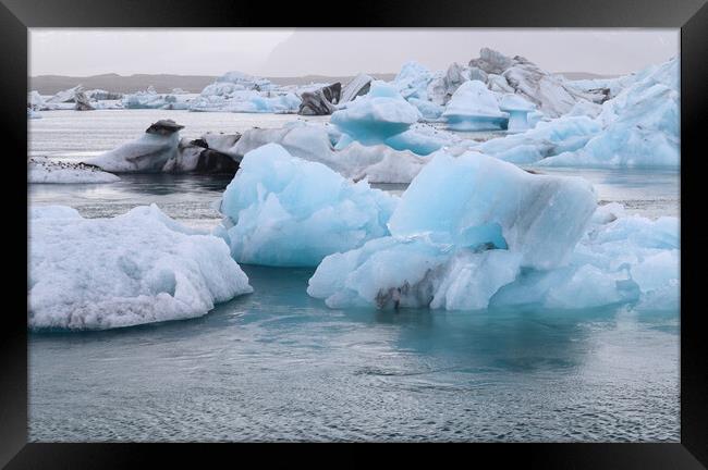 Iceland, Jokulsarlon Lagoon, Turquoise icebergs floating in Glacier Lagoon on Iceland. Framed Print by Michael Piepgras