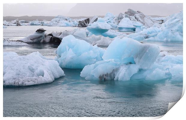 Iceland, Jokulsarlon Lagoon, Turquoise icebergs floating in Glacier Lagoon on Iceland. Print by Michael Piepgras