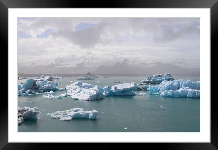 Iceland, Jokulsarlon Lagoon, Turquoise icebergs floating in Glacier Lagoon on Iceland. Framed Mounted Print by Michael Piepgras