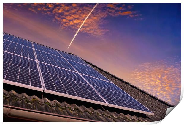 Solar panels producing clean energy on a roof of a residential house during sunset. Print by Michael Piepgras