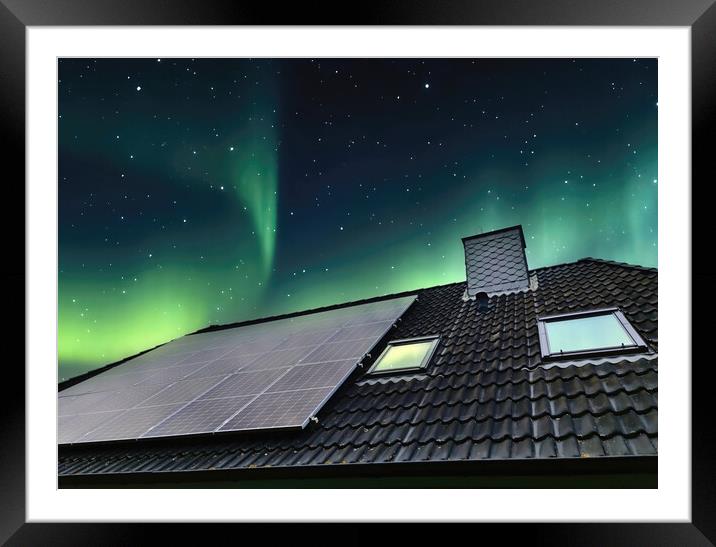 Solar panels producing clean energy on a roof of a residential h Framed Mounted Print by Michael Piepgras
