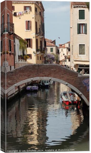 Waterways of Venice  Canvas Print by Les Schofield