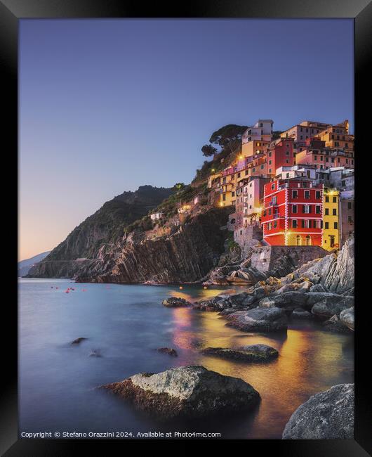 Riomaggiore town, cape and sea at sunset. Cinque Terre, Liguria, Framed Print by Stefano Orazzini