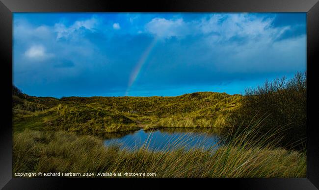 Rainbow over the Lake Framed Print by Richard Fairbairn