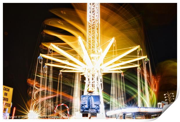 Long exposure of a brightly lit carousel at night, capturing motion blur of spinning lights at a fair. Print by Man And Life