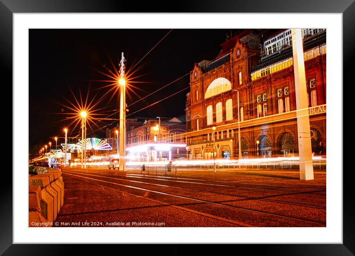 Night cityscape with illuminated buildings and light trails from traffic on a street. Framed Mounted Print by Man And Life