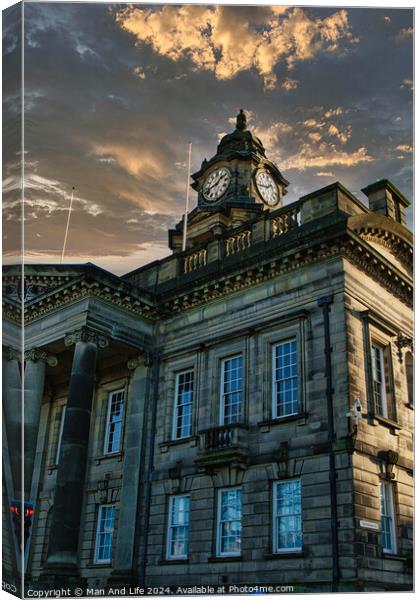 Historic building with clock tower against a dramatic sunset sky in Lancaster. Canvas Print by Man And Life