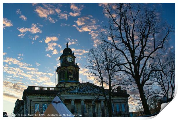 Historic building with clock tower at dusk, silhouetted trees in foreground, pink clouds in blue sky in Lancaster. Print by Man And Life