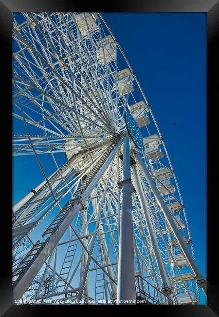 Low-angle view of a Ferris wheel against a clear blue sky in Lancaster. Framed Print by Man And Life