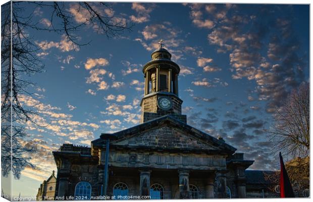 Historic stone building with clock tower against a dramatic sky at sunset in Lancaster. Canvas Print by Man And Life