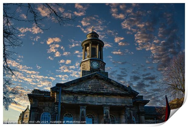 Historic stone building with clock tower against a dramatic sky at sunset in Lancaster. Print by Man And Life