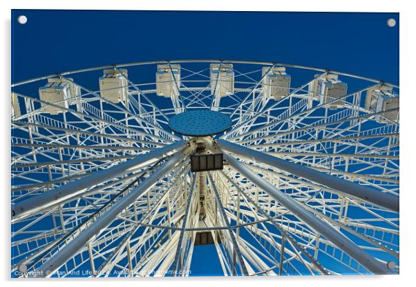 Ferris wheel against a clear blue sky, symmetrical view from below in Lancaster. Acrylic by Man And Life