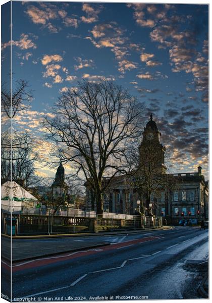 Historic building at dusk with dramatic sky and bare tree silhouette in Lancaster. Canvas Print by Man And Life