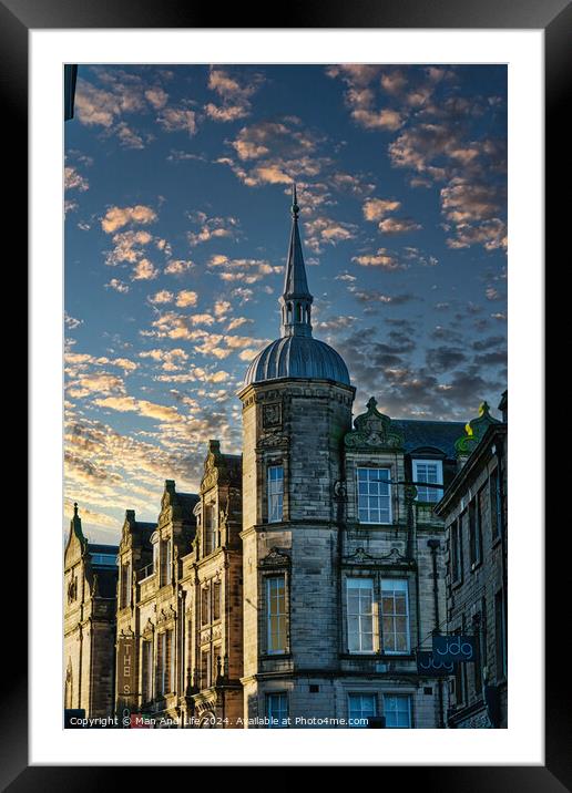 Historic building with a spire against a dramatic sky with golden sunset clouds in Lancaster. Framed Mounted Print by Man And Life